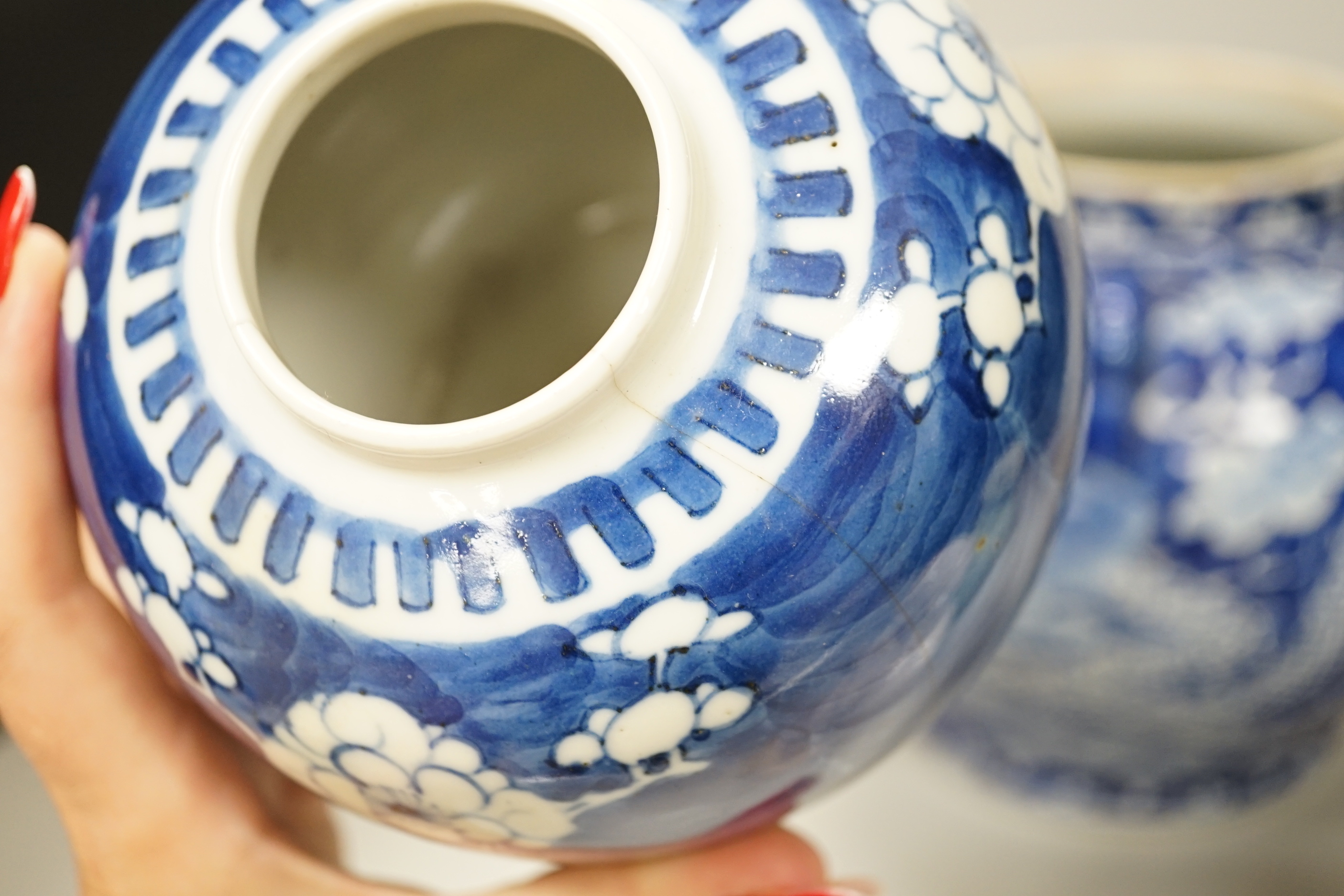 A group of Chinese ceramics including a celadon glazed vase, blue and white jar, white glazed figure and a jardiniere